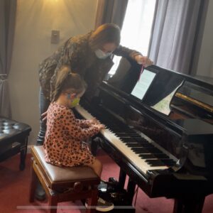 Music with Celine Boulben teaching piano